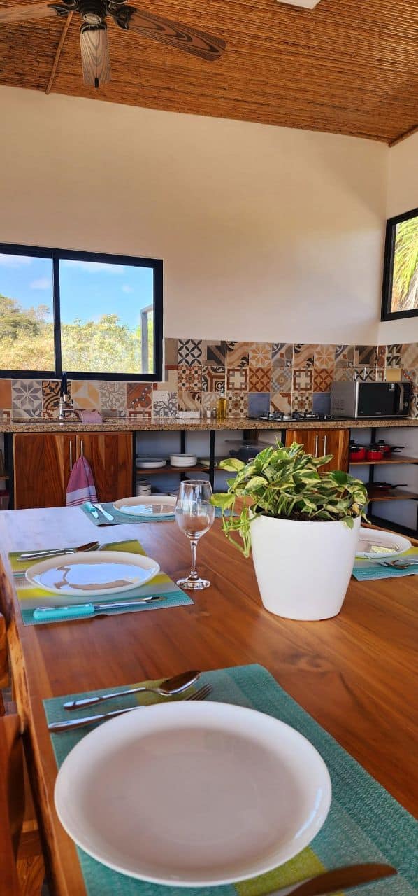 Modern kitchen decorative tiles dining area prepared table luxury vacation rental Costa Rica exclusive stay