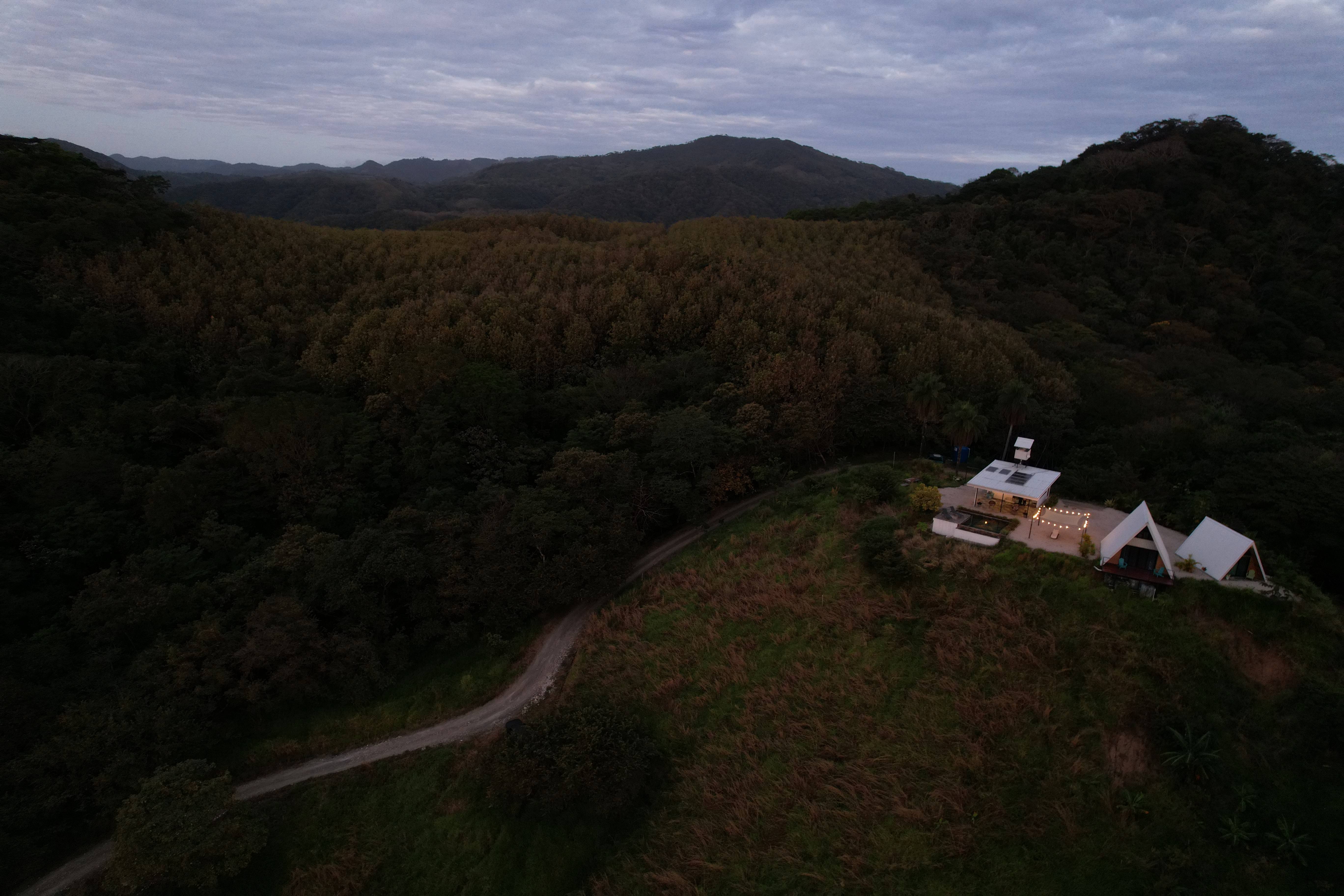 Night illuminated lodge Blue Zone mountainous landscape luxury vacation rental Costa Rica retreat