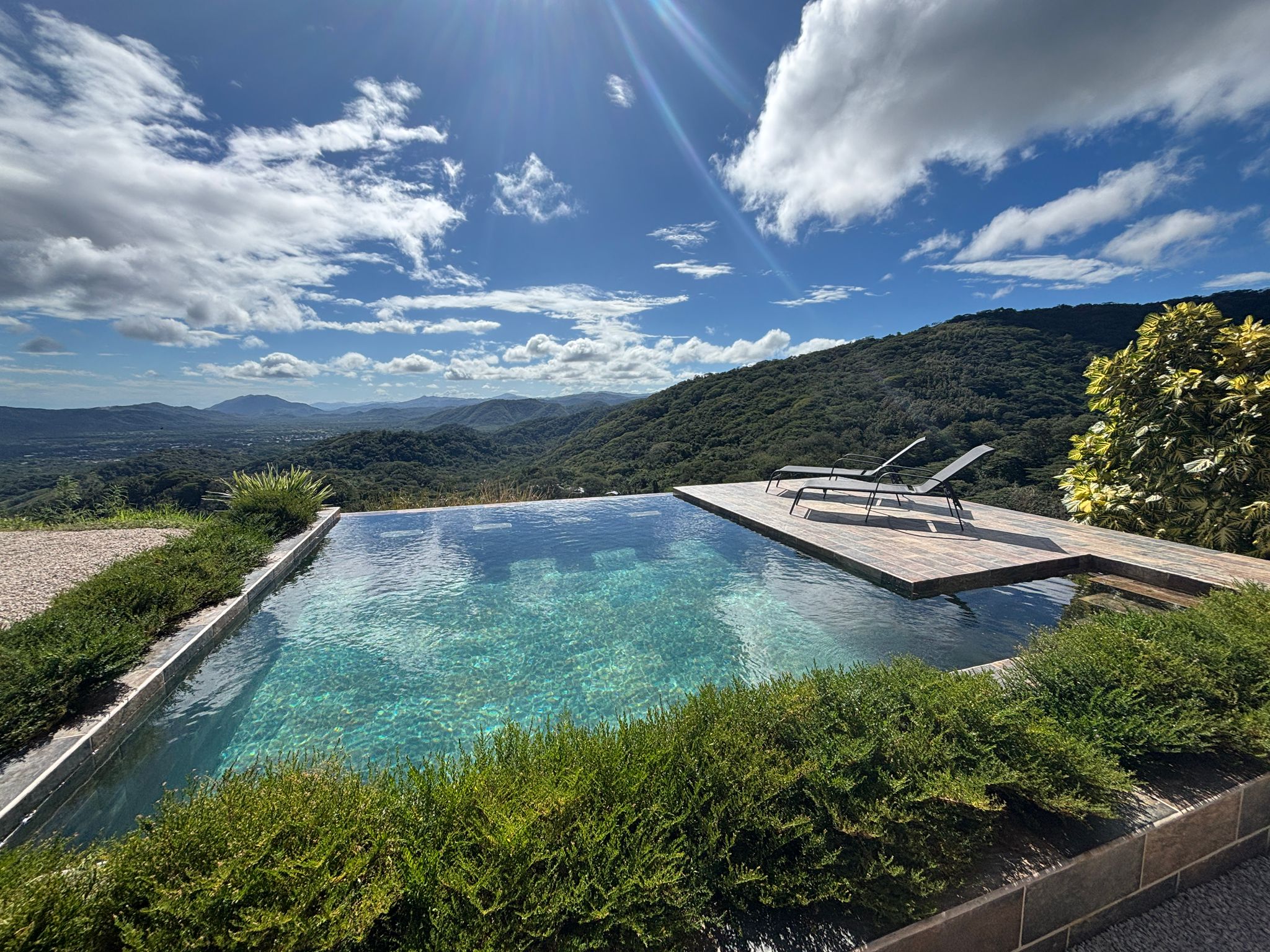 Bluesky Lodge infinity pool 180-degree panoramic view Blue Zone mountains Guanacaste Costa Rica luxury vacation rental